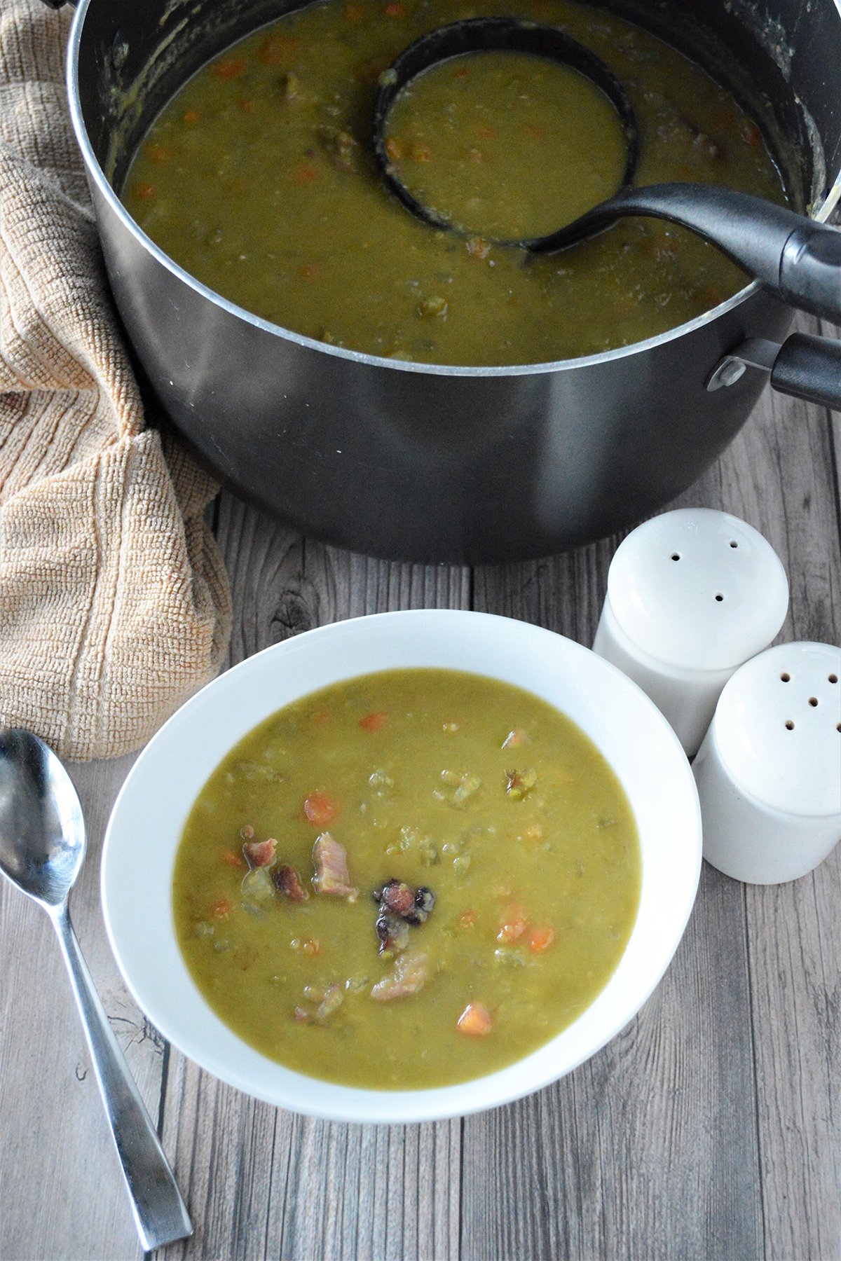 Split Pea and Ham Soup in pot and white bowl