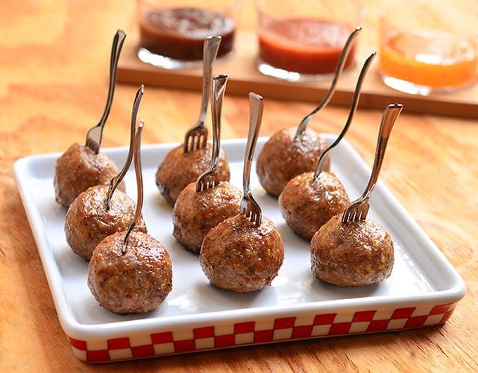 Italian meatballs perfect as party appetizers with dipping sauces or served over pasta with hearty marinara sauce. Learn the easy tips on how to make them super moist and flavorful!