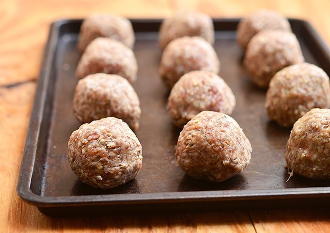 Italian meatballs perfect as party appetizers with dipping sauces or served over pasta with hearty marinara sauce. Learn the easy tips on how to make them super moist and flavorful!