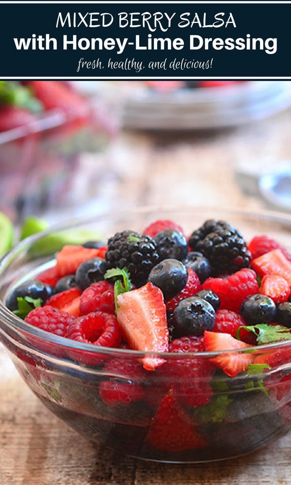 mixed berry salsa with cilantro in a clear serving bowl