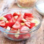 Strawberry Banana and Cream Salad with strawberries. bananas, sour cream dressing, and toasted coconut. Sweet and creamy, it's a healthy and delicious addition to any summer potluck!