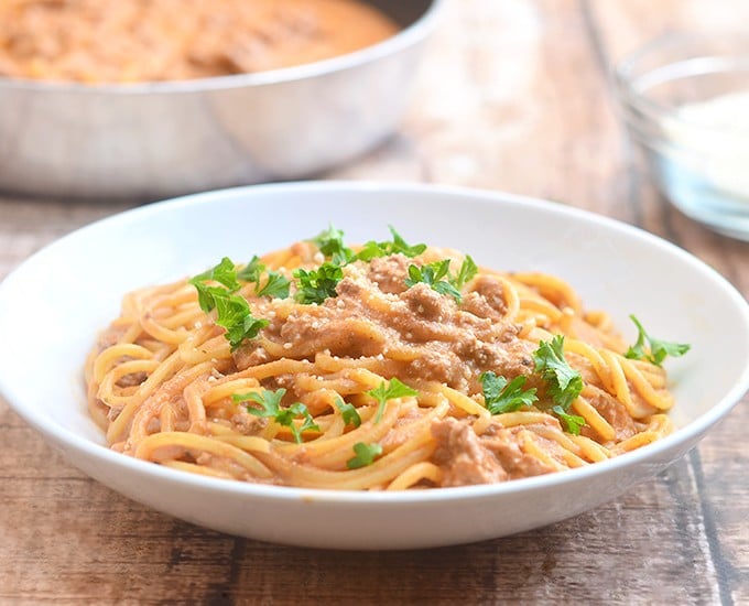 Cheesy Spaghetti with creamy tomato sauce is quick and easy to make for busy weeknights and with loads of delicious cheesy flavor the whole family is sure to love.