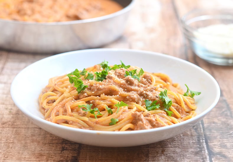 Cheesy Spaghetti with creamy tomato sauce is quick and easy to make for busy weeknights and with loads of delicious cheesy flavor the whole family is sure to love.