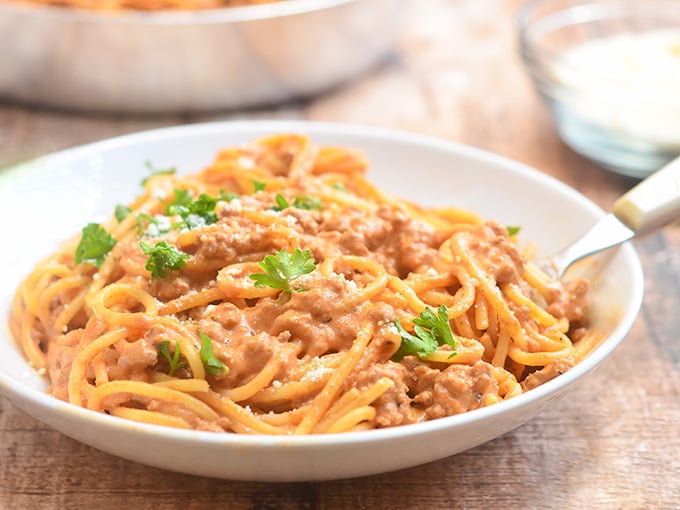 Cheesy Spaghetti with creamy tomato sauce is quick and easy to make for busy weeknights and with loads of delicious cheesy flavor the whole family is sure to love.