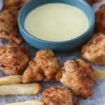 Crispy Popcorn Chicken with a bowl of honey mustard dipping