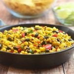 Roasted Corn and Black Bean Salad bursting with the smoky flavors of grilled corn, poblano peppers; and black beans. Delicious as a dip for tortilla chips yet just as awesome as a vegetarian filling for enchiladas or quesadillas.