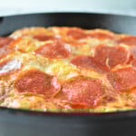 Pepperoni Bubble Pizza baked in a cast iron skillet.