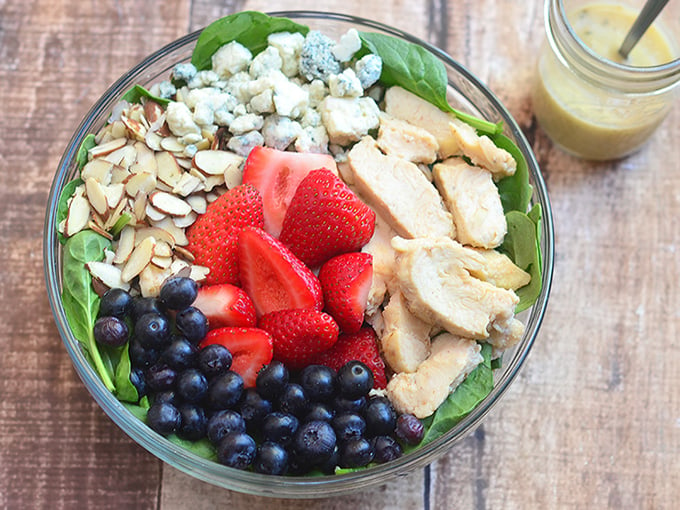 Berry Chicken and Spinach Salad with Honey Mustard Dressing chock-full of verdant spinach leaves, moist chicken, juicy berries, crunchy almonds, pungent blue cheese, and a sweet and tangy dressing. With fresh, bright flavors, it is a light yet satisfying summer salad!