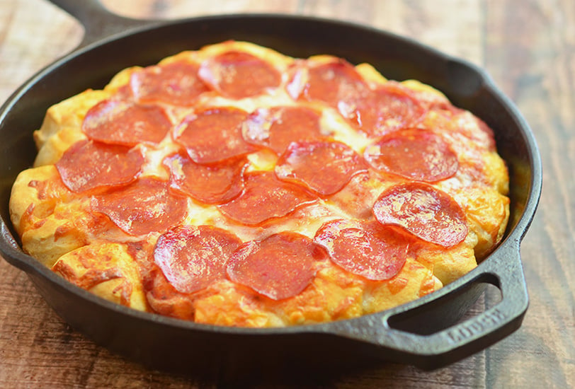 Bubble Pizza is a quick and easy pan pizza made with only 4 ingredients and in less than 30 minutes! It's fun party or snack option everyone will devour!