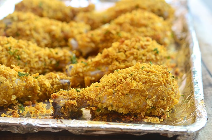 Cornflake chicken coated in cornflake crumbs for crunchy, juicy chicken perfection without deep-frying. Loads of flavor with less work and less fat!