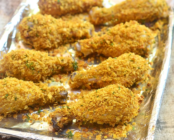 Cornflake chicken coated in cornflake crumbs for crunchy, juicy chicken perfection without deep-frying. Loads of flavor with less work and less fat!