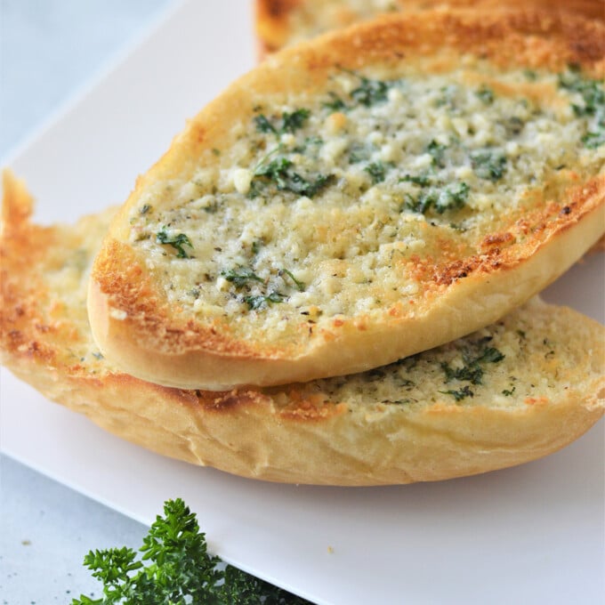 garlic bread on a white platter