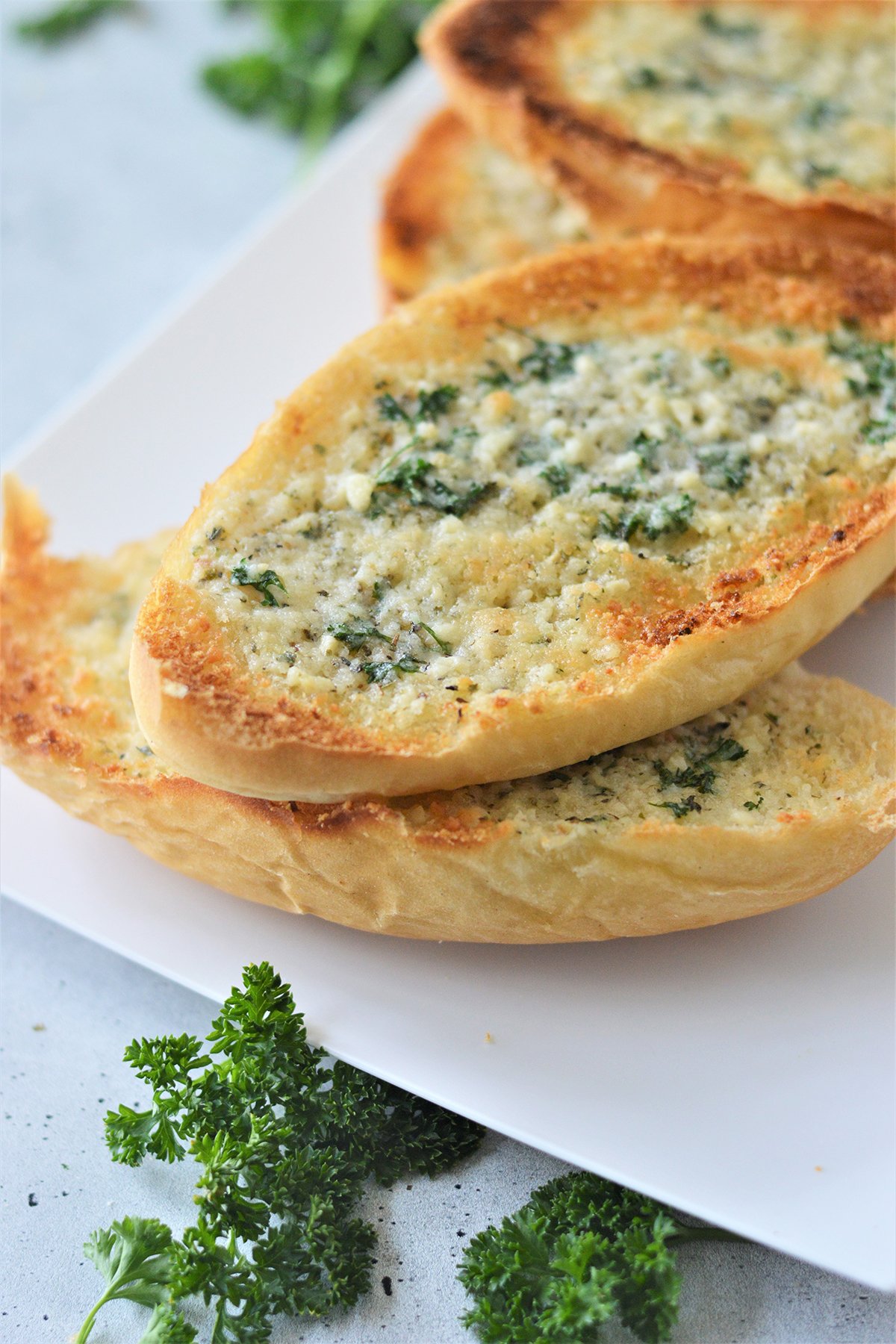 garlic bread on a white platter