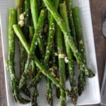 Garlic Parmesan Roasted Asparagus on a white platter