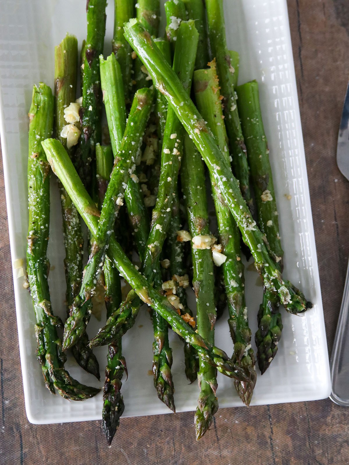 Garlic Parmesan Roasted Asparagus on a white platter