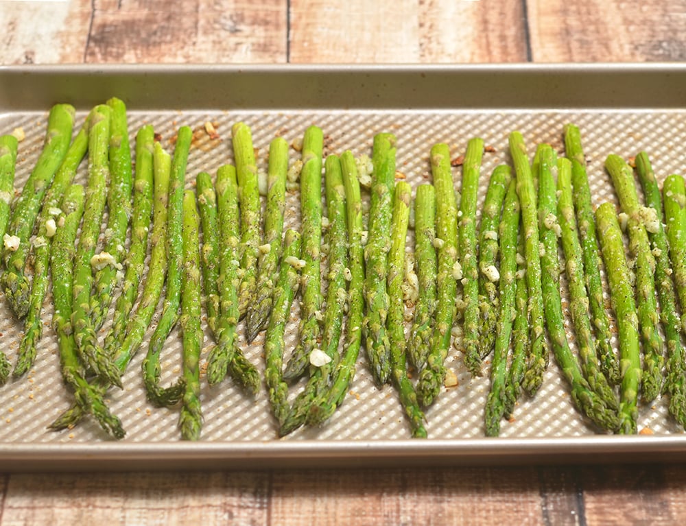 Garlic Parmesan Roasted Asparagus are your next favorite side dish! Tender-crisp and loaded with garlic and Parmesan, they're super easy to make yet absolutely tasty!
