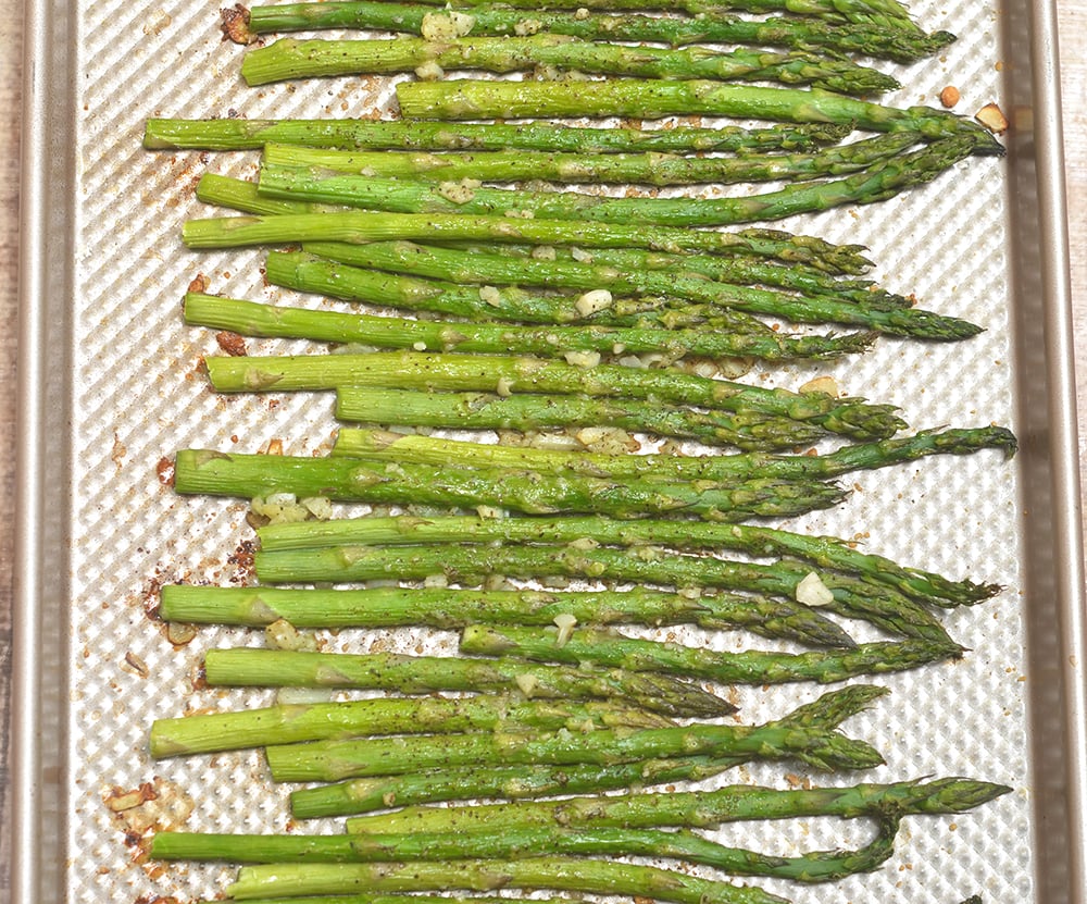 Garlic Parmesan Roasted Asparagus are your next favorite side dish! Tender-crisp and loaded with garlic and Parmesan, they're super easy to make yet absolutely tasty!