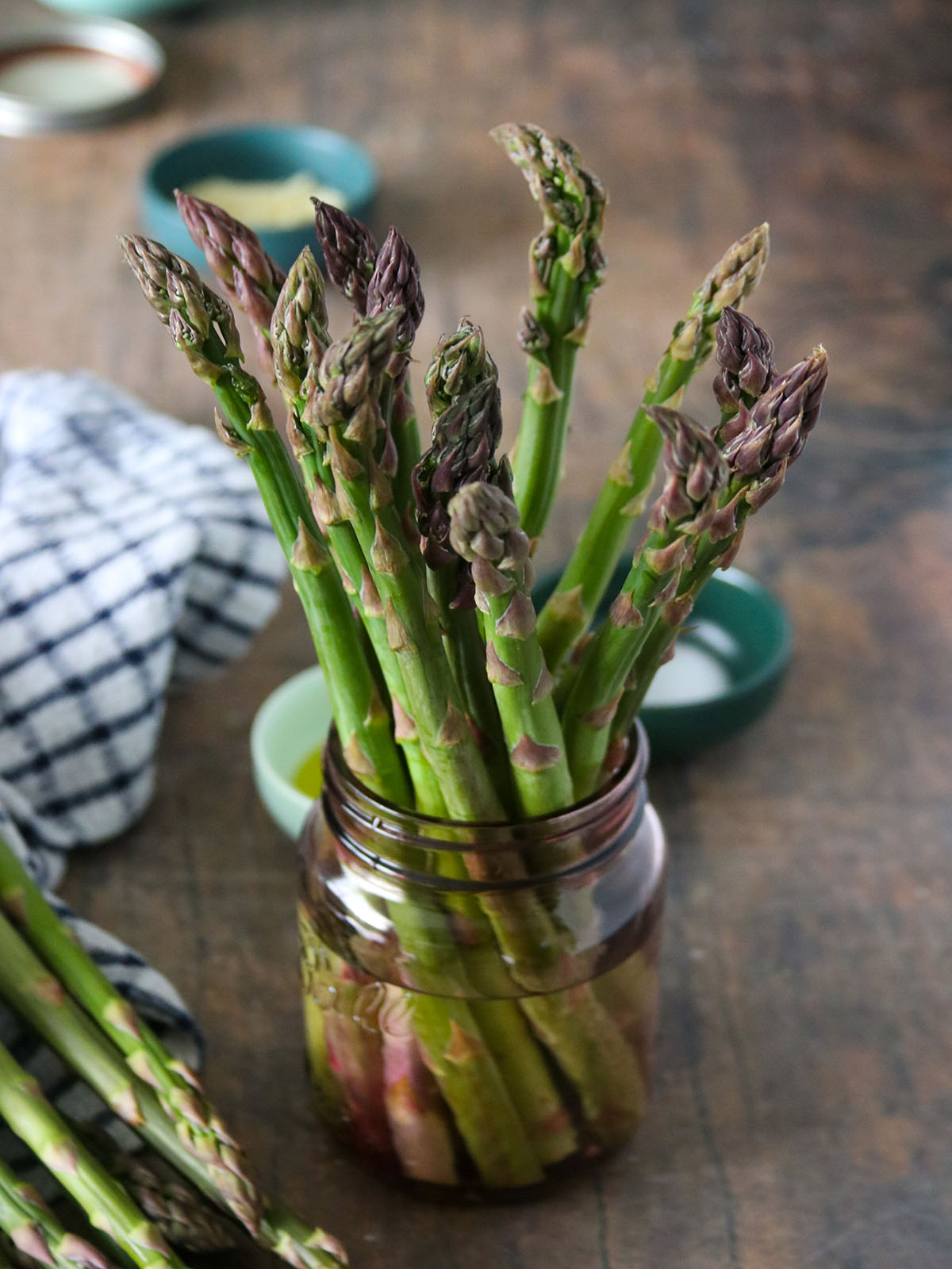 soaking asparagus in a jar of water