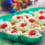 Coconut macaroons with colorful maraschino cherry centers make the perfect gift this holiday season. Soft and chewy, they're sure to be everyone's favorite treat!