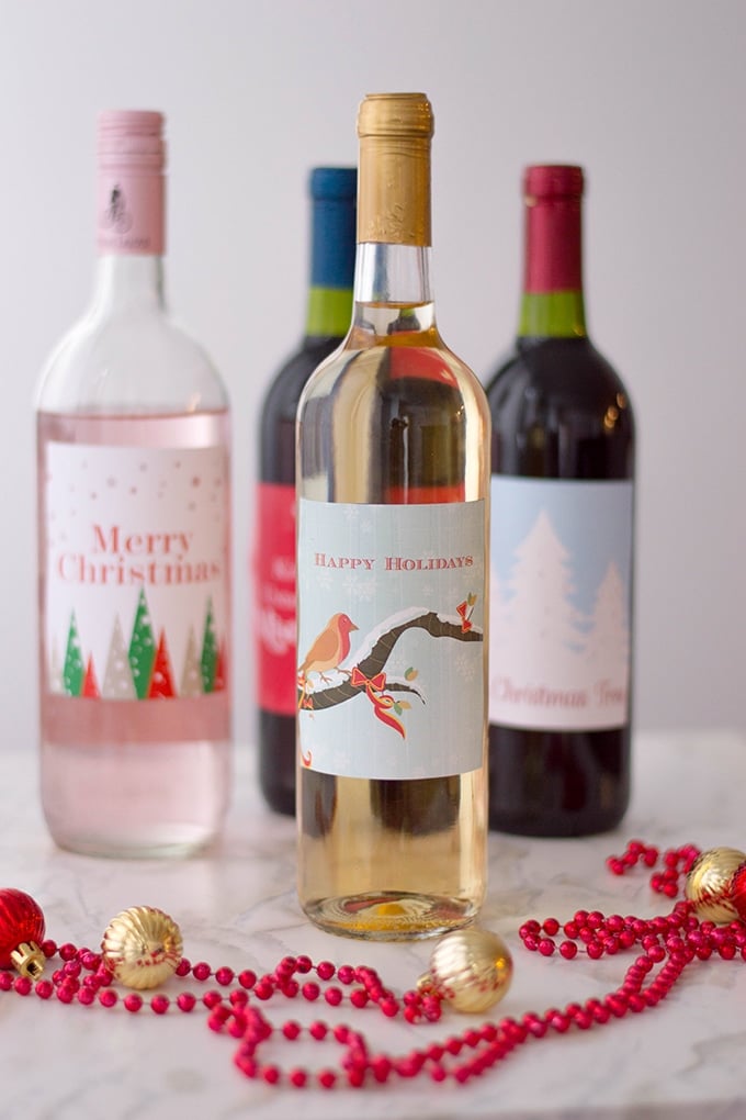 four bottles of wine with Christmas labels