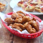 Orange-Glazed Boneless Wings fried until crisp and tossed in a mouthwatering orange glaze. Sweet, tangy and in fun bite size, they're seriously addicting!