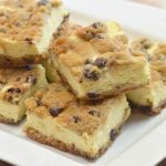 Chocolate Chip Cookie Cheesecake bars with creamy cheesecake filling sandwiched between chewy chocolate chip cookie layers. They're a delicious marriage of two all time favorites!