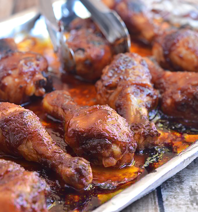 Sriracha-Hoisin Glazed Chicken Drumsticks are marinaded in a sweet, spicy Sriracha and hoisin glaze. They're easy to make for an amazing weeknight meal!