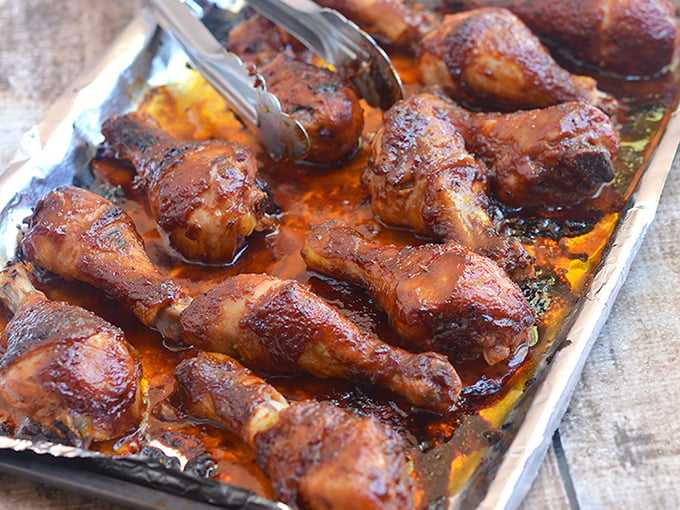 Sriracha-Hoisin Glazed Chicken Drumsticks are marinaded in a sweet, spicy Sriracha and hoisin glaze. They're easy to make for an amazing weeknight meal!