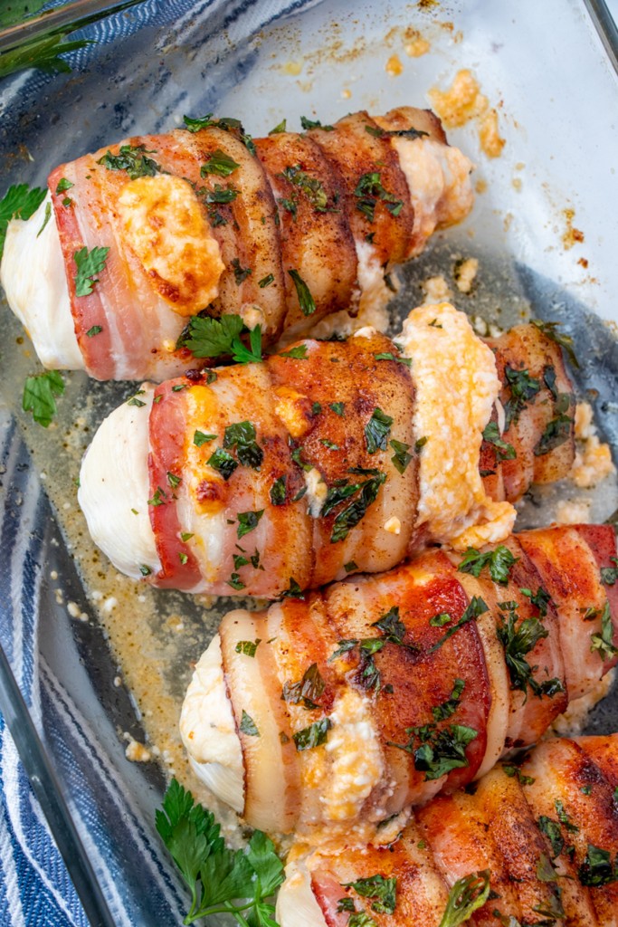 baked chicken breast with cheese filling in a baking dish
