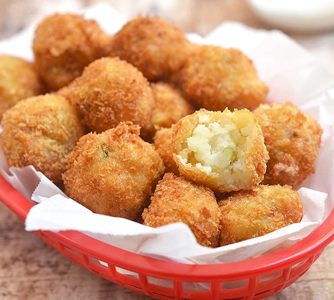 Golden brown fried mashed potato Croquettes with green onions and bacon