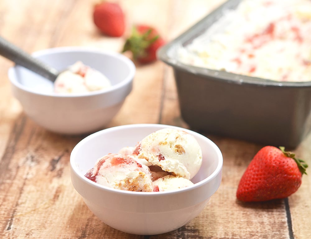 Strawberry Swirl Cheesecake Ice Cream bursting with strawberry and cheesecake flavor is a must for summer! It's rich and creamy with no churning or no ice cream maker needed.