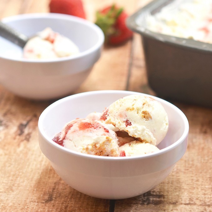 Strawberry Swirl Cheesecake Ice Cream bursting with strawberry and cheesecake flavor is a must for summer! It's rich and creamy with no churning or no ice cream maker needed.