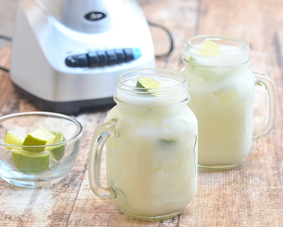 Creamy condensed milk is blended with fresh limes for a sweet and tangy summer drink