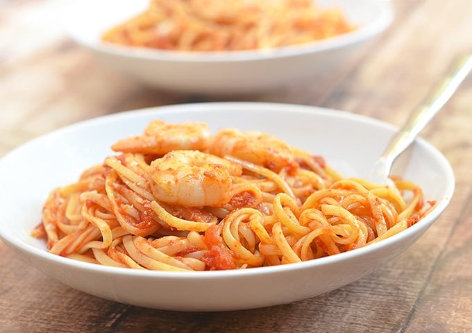 Linguine Fra Diavolo with shrimp in a white serving plate