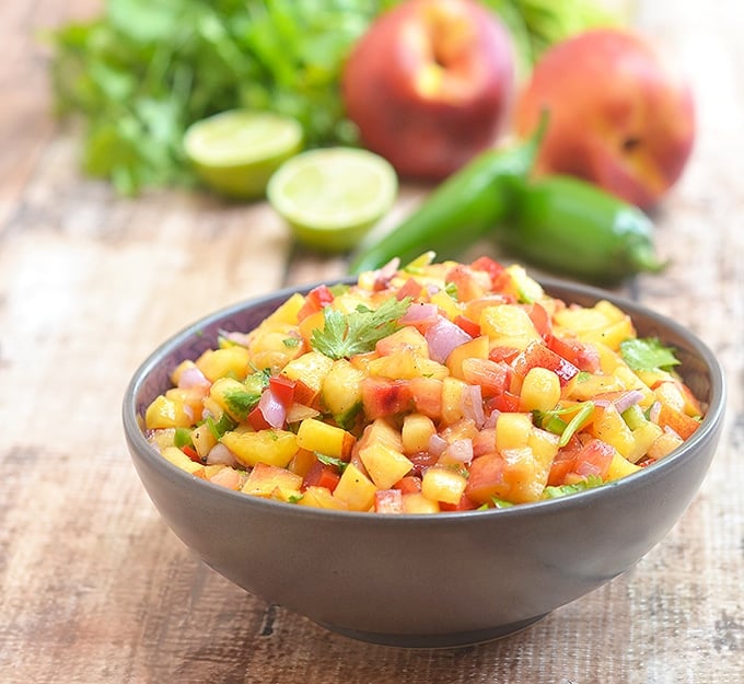 nectarine salsa made with nectarines, lime, cilantro, and jalapenos in a ceramic serving bowl