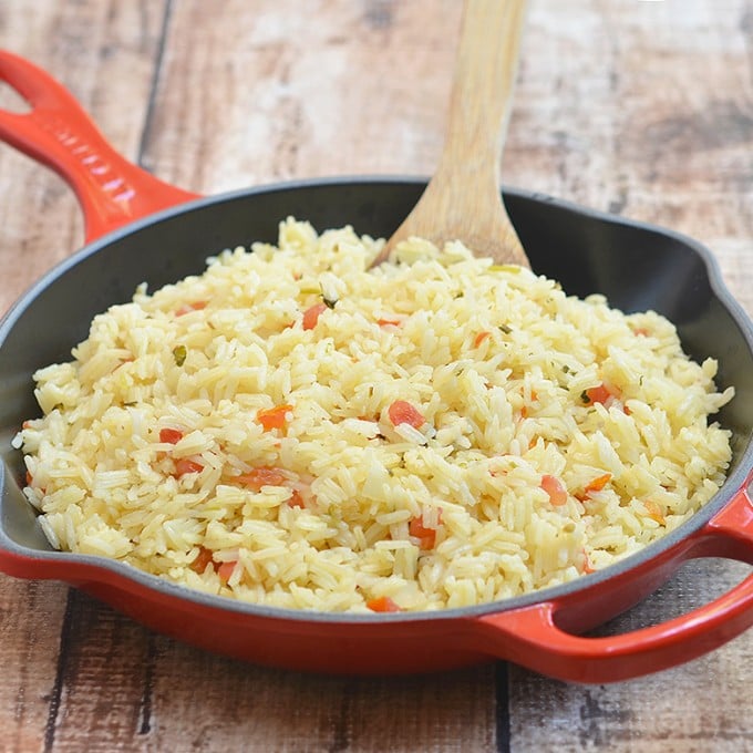 Spanish rice with fresh tomatoes, onions, garlic, cilantro, and lime juice is the perfect accompaniment to your favorite Mexican entrees. Quick and easy to make and cooks in one pan!