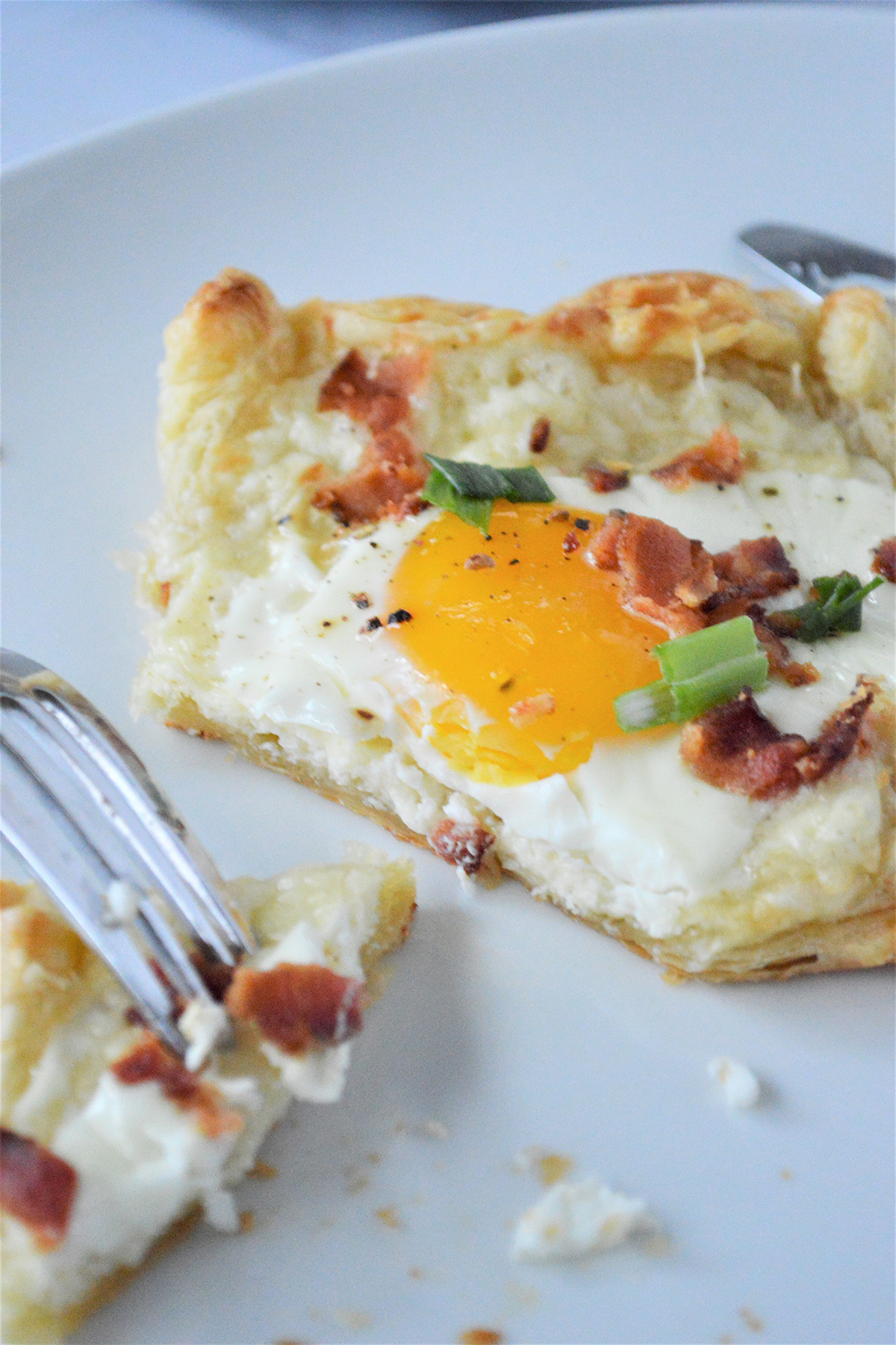 puff pastry baked eggs on a white plate