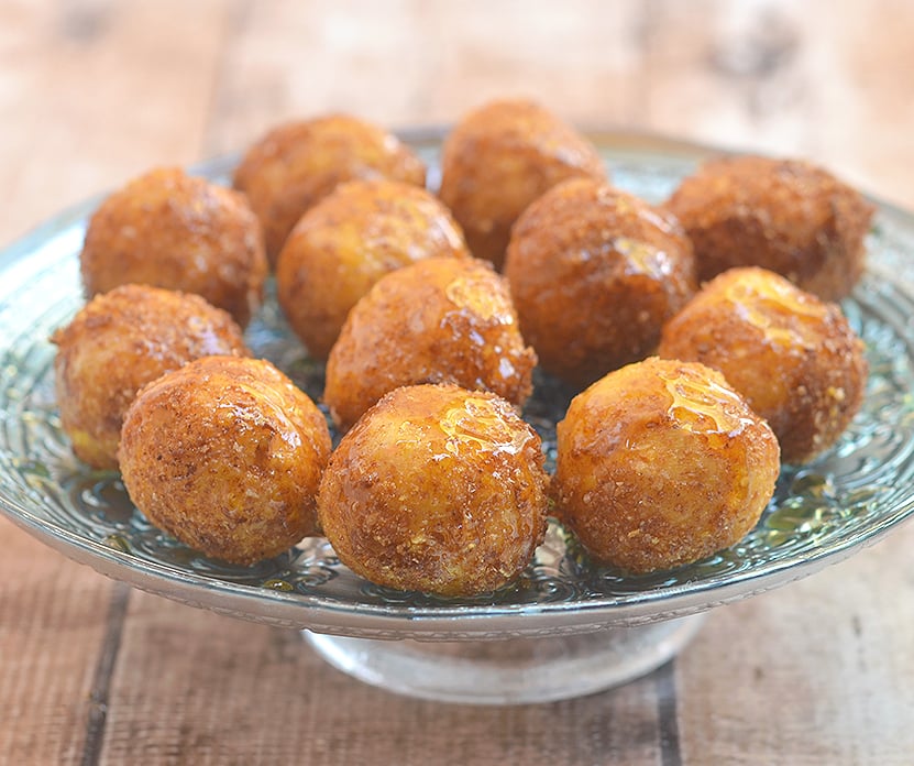 Fried goat cheese balls with honey are this holiday season's appetizer of choice! A delightful combination of sweet, creamy and crunchy, they're sure to be a party favorite!