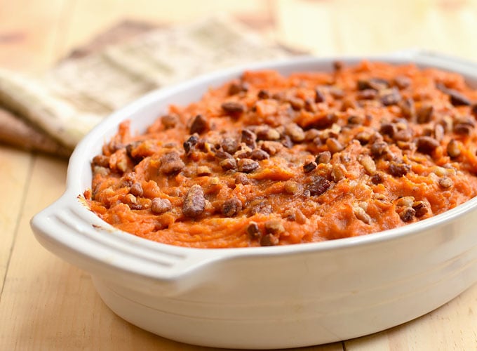 Sweet Potato Casserole with Rum and Candied Pecans is a must-have holiday side dish. Fluffy with a spike of rum flavor and crunchy sweet pecan topping, it's the perfect accompaniment toThanksgiving turkey or Christmas ham.
