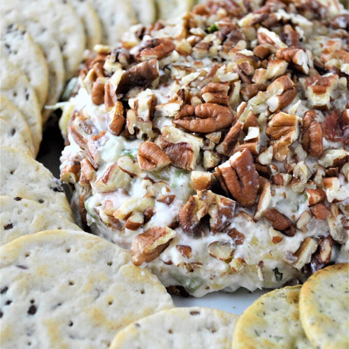 Pineapple Cheese Ball on a platter with crackers