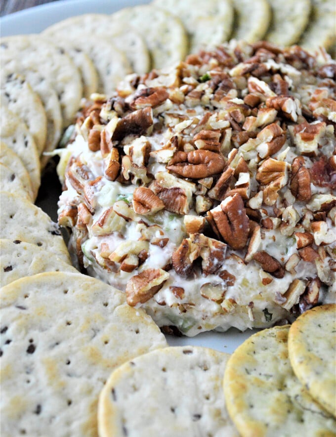 Pineapple Cheese Ball on a platter with crackers