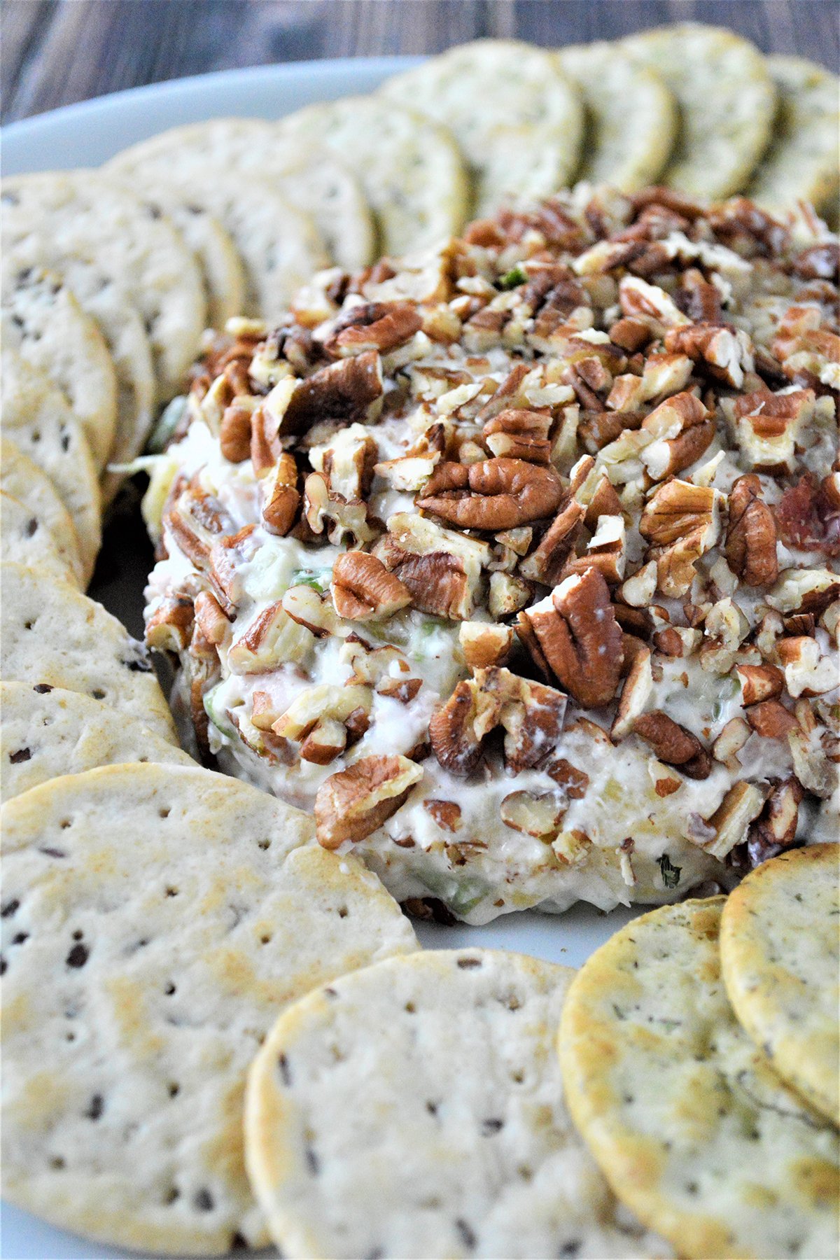 Pineapple Cheese Ball  on a platter with crackers