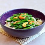 Asparagus and Cashew Stir-fry with tender-crisp asparagus and crunchy cashews served over nutty brown rice. A vegan dish that's as nutritious as it is delicious!