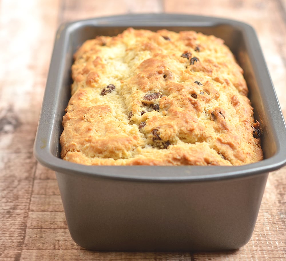 Irish Soda Bread baked in a loaf pan. Golden, moist and studded with raisins, perfect for St. Patrick's Day!