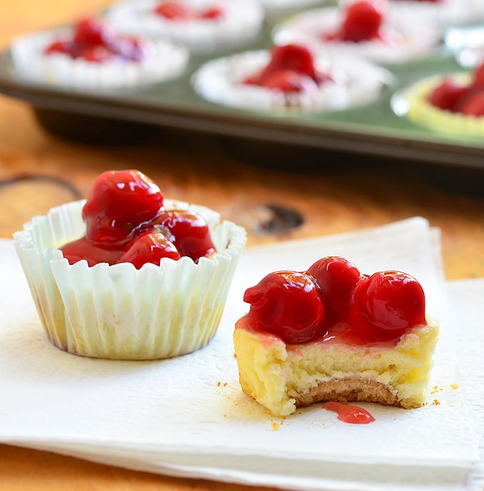 Mini Cherry Cheesecakes with vanilla wafer crust, creamy cheesecake, and cherry topping are as easy to make as they are delicious. They're the perfect-sized sweet treat for one but are just as amazing for a large crowd!