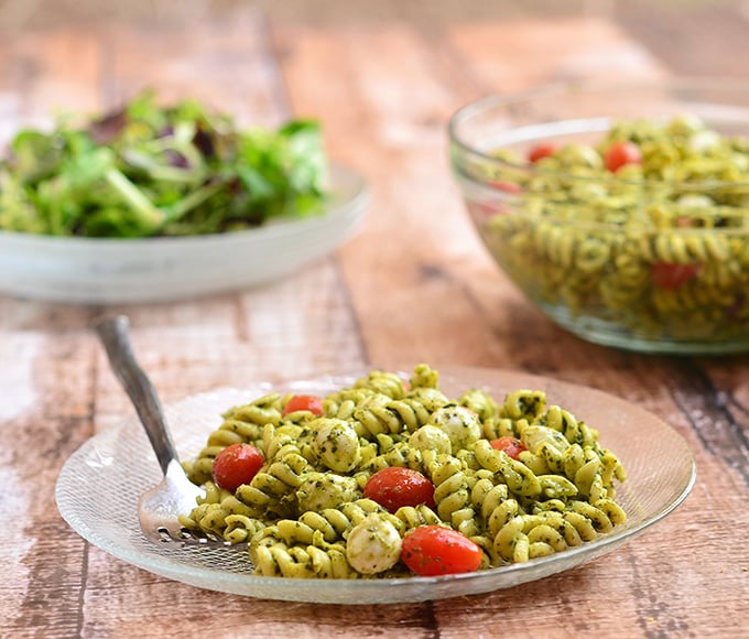 Pesto pasta salad with al dente pasta, bocconcini, and juicy cherry tomatoes is delicious with this special pesto recipe.