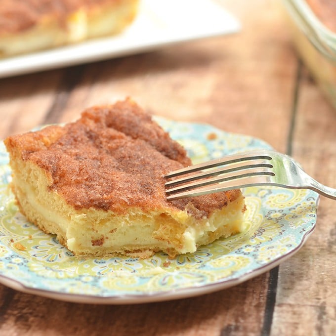 Sopapilla Cheesecake Bars with pillowy, cinnamon pastry and dreamy cheesecake layer are ridiculously easy to make yet absolutely delicious. Make sure to double the batch as your guests will be lining up for more!