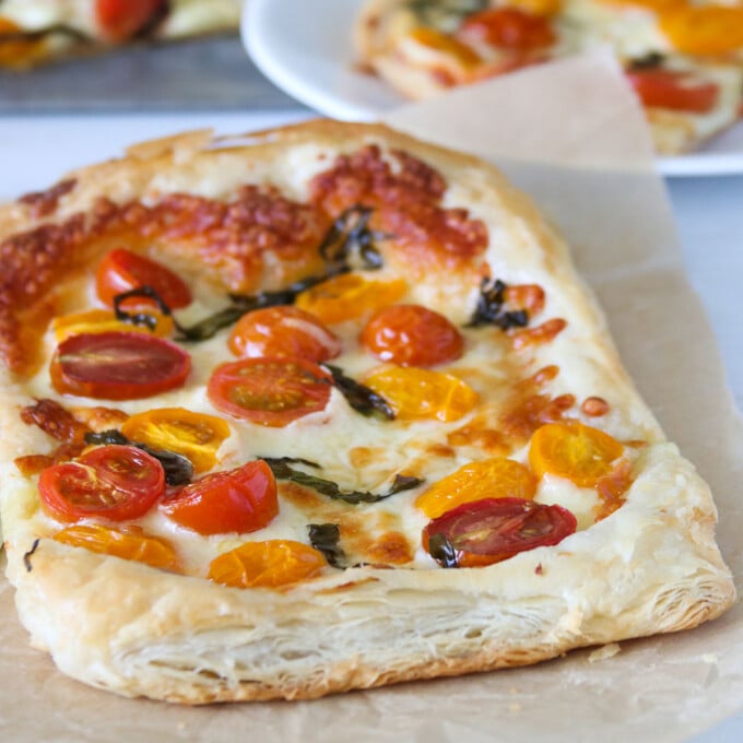 freshly baked Puff Pastry Margherita Pizza on a parchment paper