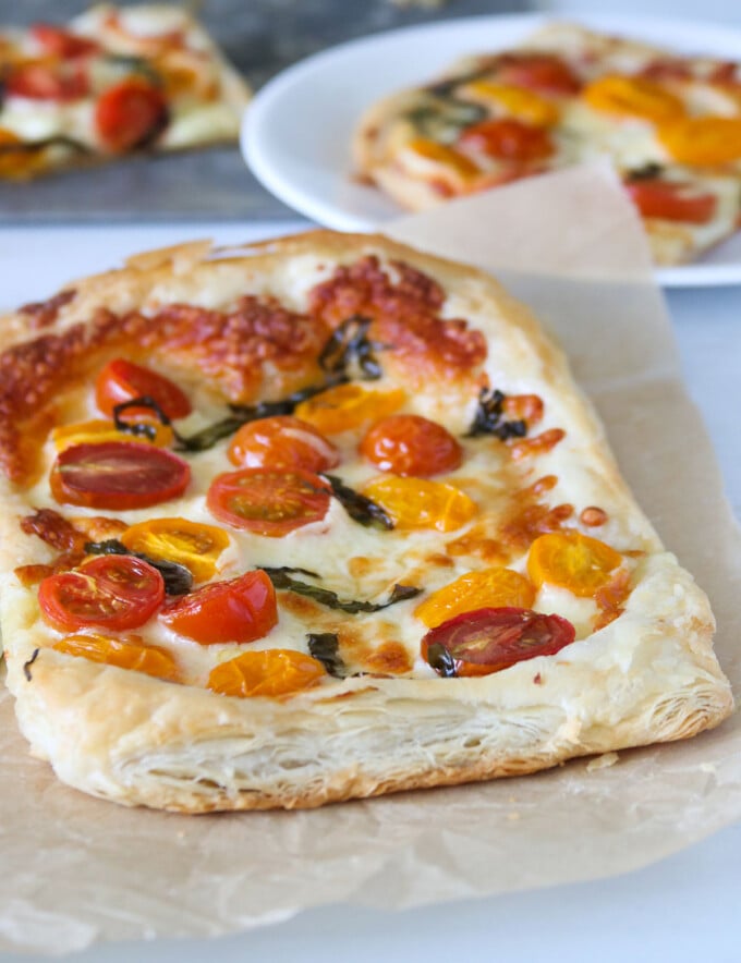 freshly baked Puff Pastry Margherita Pizza on a parchment paper