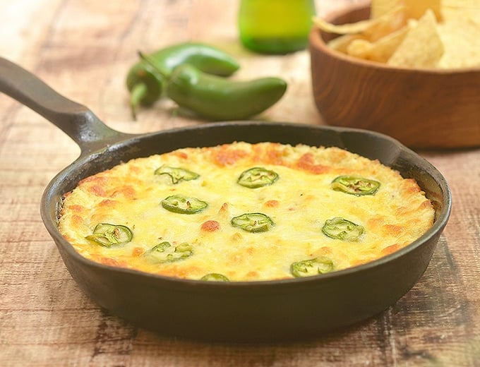 Cheesy Jalapeno Popper Dip baked in a cast iron pan